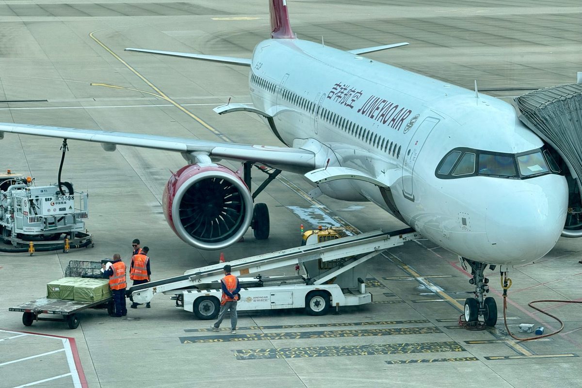 Cargo being loaded onto a freighter aircraft at an airport terminal