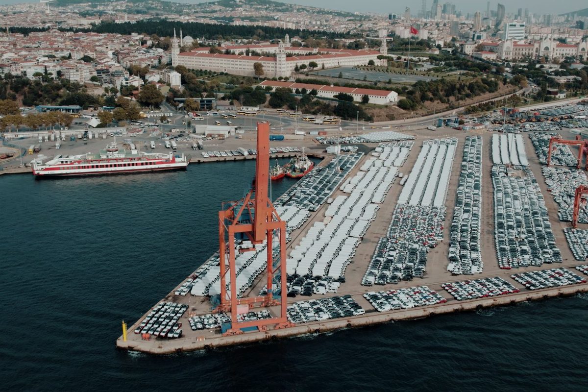 Rows of cars staged on the quay at a port vehicle terminal
